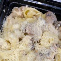 Tortellini Alfredo · Tortellini served with house creamy alfredo sauce, chicken and mushrooms.