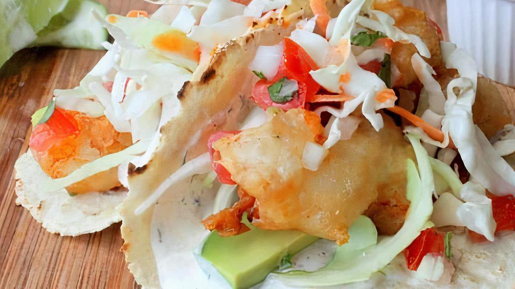 Baja Tacos · Breaded cod fish or shrimp, lettuce, tomatoes, and mild chipotle mayonnaise sauce.