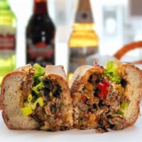 Hogi Cheesesteak · With grilled onions, hot and sweet peppers, mayo, lettuce, and tomato.