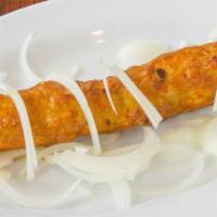 41. Chicken Kabab Roll · Chicken seekh kabab rolled in fresh naan w/ onions & mint sauce.