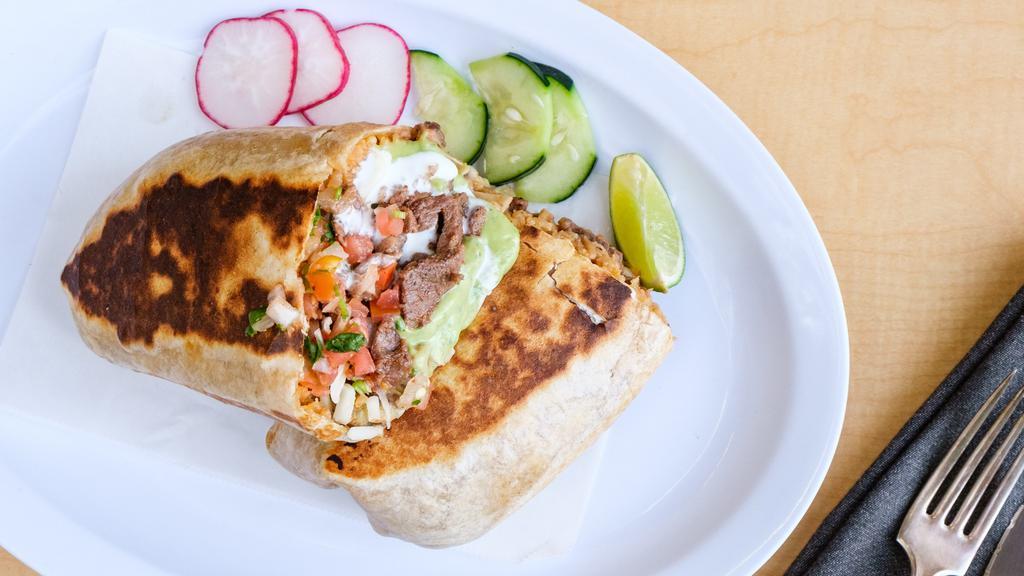 Super Steak Burrito · Steak, rice, beans, sauce, pico de gallo, sour cream, cheese, and guacamole.
