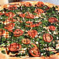 Baby Spinach Caprese Pizza · Eight slices. Crust brushed with olive oil and garlic, mozzarella, baby spinach, and sliced ...