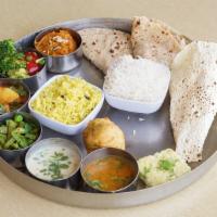 Large Family TOGO · Meal for 7-8 people. 
Choice of 3 Curries - 32 Oz each +
Choice of Dal - 32 Oz +
 Roti (20 p...