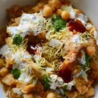 Samosa Chaat · Triangular Crispy Shell stuffed with Spiced Potatoes topped with chana curry, sweet and spic...