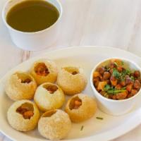 Pani Puri · Crispy puffed wafers filled with Potato, Chickpeas, and Sprouts served with Spicy Mint water...