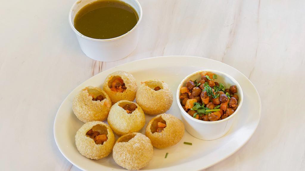 Pani Puri · Crispy puffed wafers filled with Potato, Chickpeas, and Sprouts served with Spicy Mint water and Chutneys