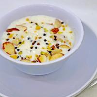 Srikhand · Chef's Speciality - Velvety sweetened yogurt made with Raisin, Almond, Pistachio and Cardamom.