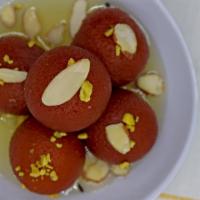 Gulab Jamun · Classic Indian Dessert - Spongy balls made of Cottage Cheese soaked in Sugar syrup.