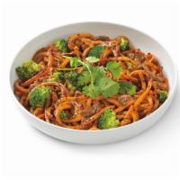 Japanese Pan Noodles · Caramelized udon noodles in sweet soy sauce, broccoli, mushrooms and carrots topped with bla...