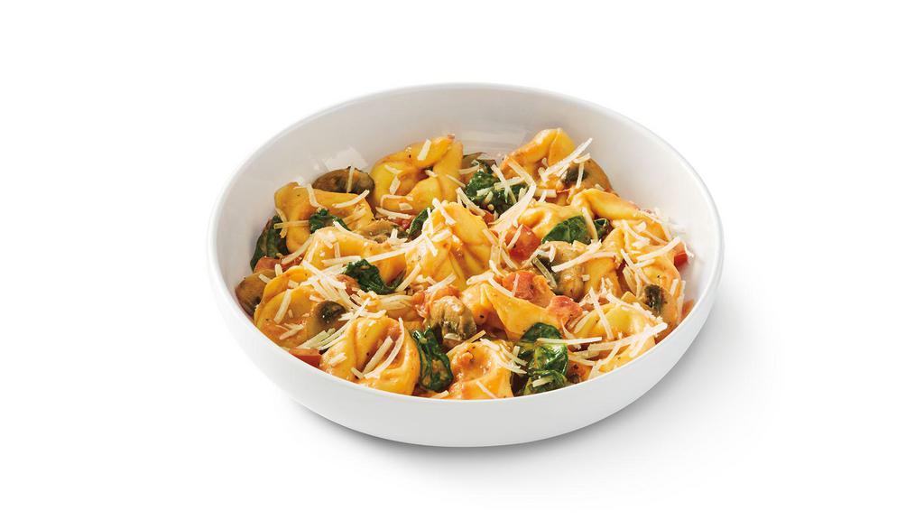 3-Cheese Tortelloni Rosa · Tortelloni filled with a blend of ricotta, mozzarella, parmesan, onions and garlic in spicy tomato cream sauce with mushrooms, Roma tomato, spinach and parmesan.. S | V .