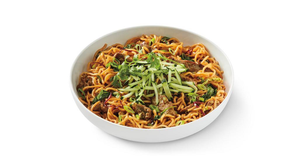 Spicy Korean Beef Noodles · Lo mein noodles tossed with a sweet and spicy Korean-style Gochujang BBQ sauce, marinated steak, spinach, napa and red cabbage topped with cucumber, green onions and cilantro. . SS.