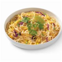 Pad Thai · Rice noodle stir-fry with scrambled egg, napa and red cabbage topped with peanuts, green oni...
