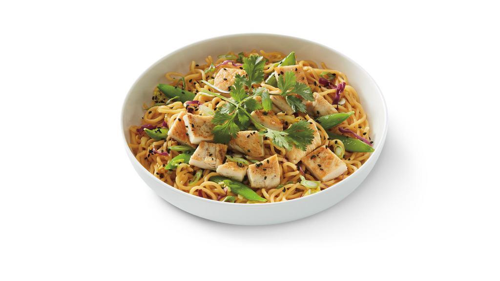 Grilled Orange Chicken Lo Mein · Lo mein noodles in orange sauce with grilled chicken, snap peas, napa and red cabbage topped with green onions, black sesame seeds and cilantro. .