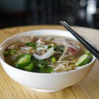 Rare Steak Phở · Beef filet mignon slices, beef broth and rice noodle. 
also come with side of vegetables (Ba...