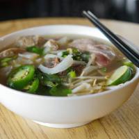 Brisket Pho · Beef Brisket slices, rice noodles and beef broth, also come with side of vegetables (Basil, ...
