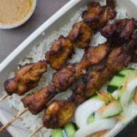 Chicken Skewers with Coconut Rice · 3 Chicken Skewers marinated in lemongrass spice, served with Coconut rice and cucumber garni...