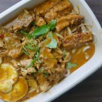 Laksa Chicken Noodle · Rice noodle and chicken served in a hearty seafood and coconut broth with bean sprout, fried...