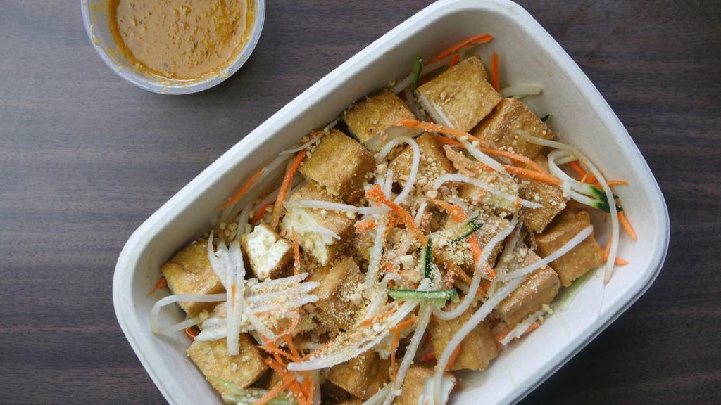 Tofu Salad with Peanut Sauce · Fried firm tofu. Garnished with bean sprouts, sliced cucumbers and jicama, dressed in a sweet and savory peanut gravy.