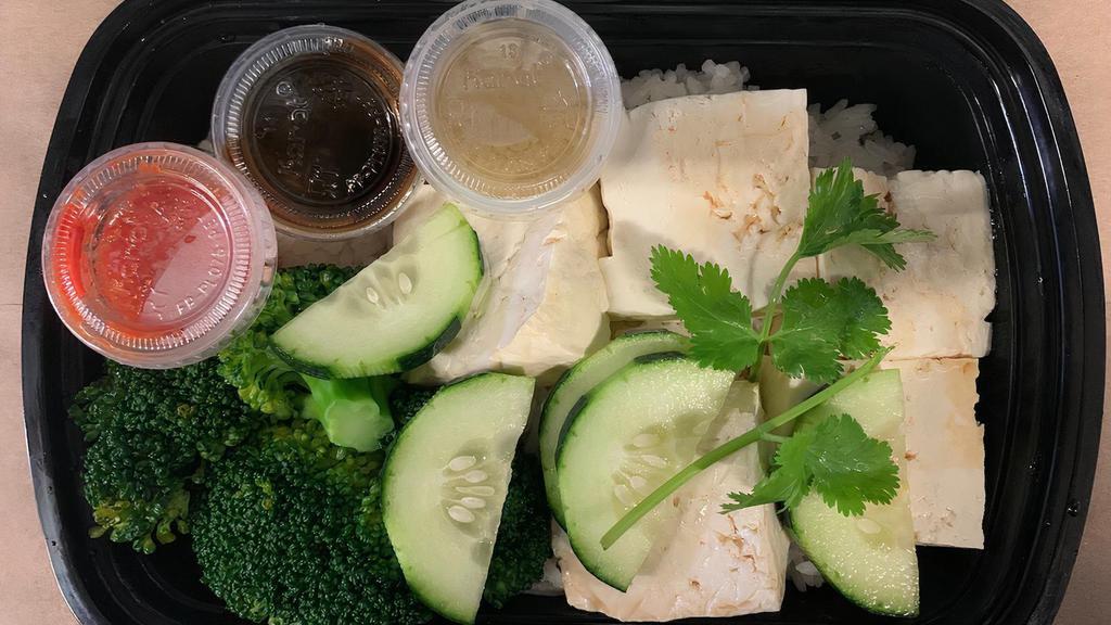 Tofu with Greens and Coconut Rice · Fresh organic tofu served with vegetables and coconut flavored rice.