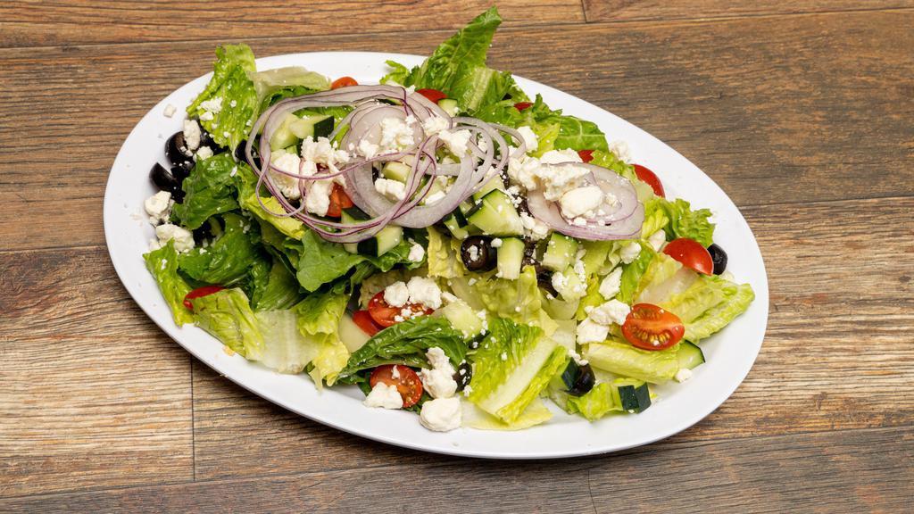 Greek Salad · Romaine lettuce, feta cheese, cucumbers, black olives, cherry tomatoes, red onions, with Greek feta vinaigrette.