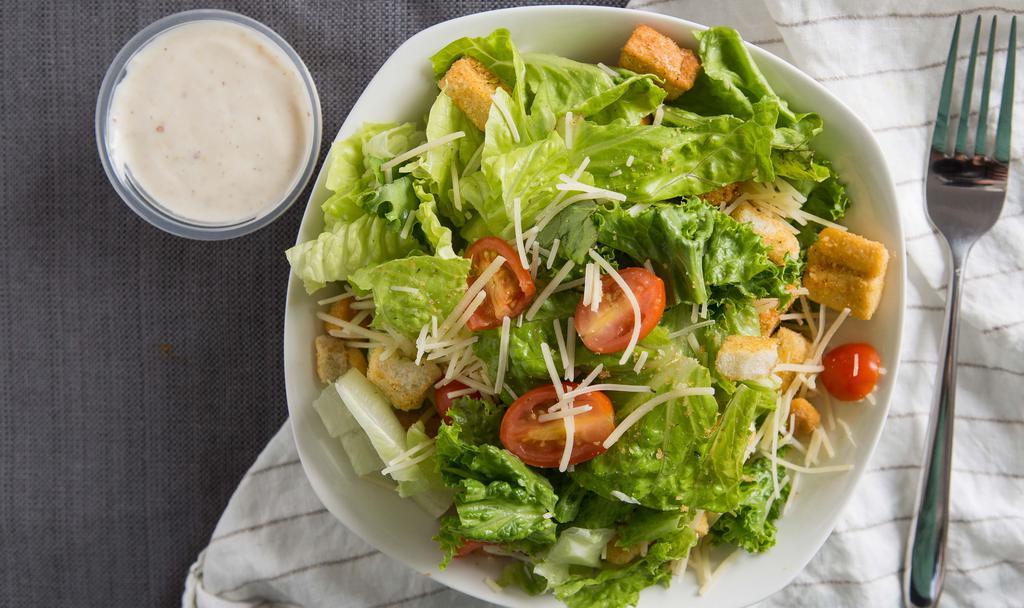 Caesar Salad · Romaine lettuce, cherry tomatoes, Parmesan cheese, croutons with Caesar dressing. Add chicken at an upcharge.