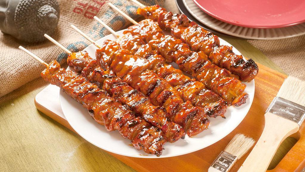 Pork BBQ (each) · Sweet, salty, a tad spicy filipino-style kebob, thin sliced pork marinated in filipino-style barbecue sauce and skewered in bamboo sticks.
