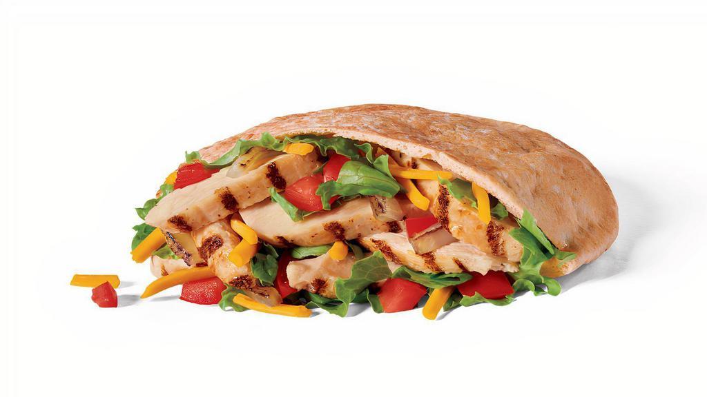Chicken Fajita Pita · Warm pita bread filled with Julienne chicken pieces, shredded Cheddar cheese, lettuce, grilled onions, tomato, and served with Fire Roasted salsa