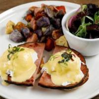 Classic Eggs Benedict · Buttery toasted English Muffin topped with two poach eggs, homemade hollandaise sauce and th...