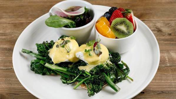 #23. Eggs Florentine · Two poached eggs, spinach, grilled broccolini and homemade hollandaise sauce on an English muffin.