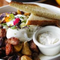 Chunky Corned Beef Hash · Two poached eggs, onion, bell peppers, potatoes, home-made horseradish cream.