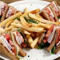 Club Sandwich · Bacon, smoked Turkey, lettuce, onion, tomatoes, Swiss cheese and mayonnaise on wheat bread.