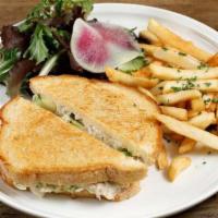 Crab Melt Sandwich · Crab, avocado, Jack cheese, and homemade Aioli served on toasted sourdough with salad and Fr...