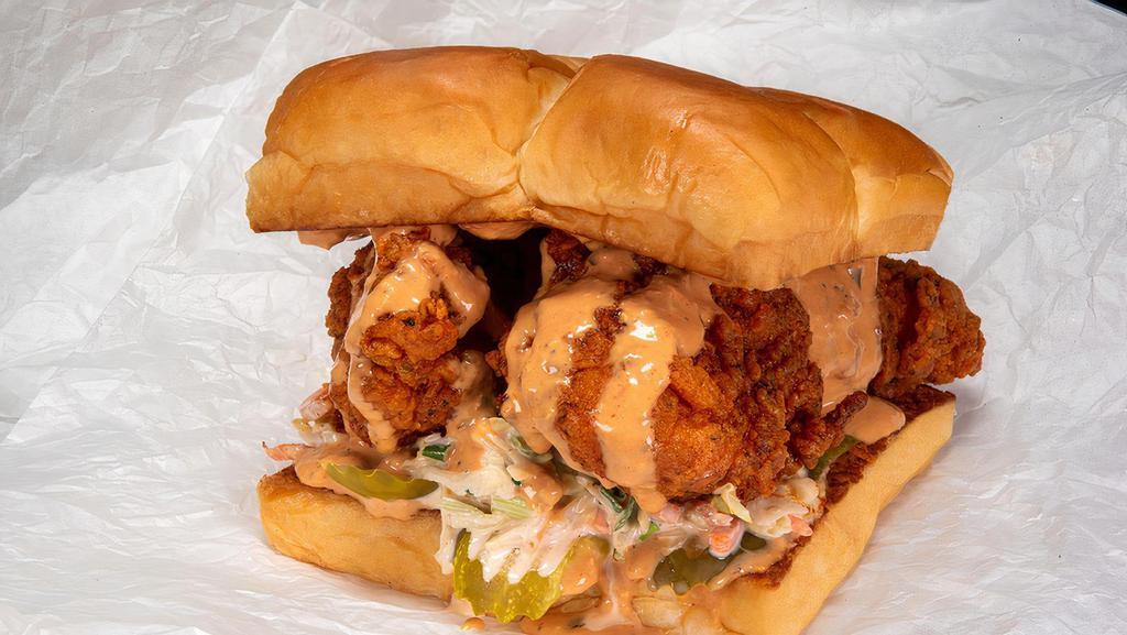 Hot Chick · Two crispy fried chicken tenders, spiced to your liking, Plain, Nashville Hot or Nashville Hotter with secret sauce, dill pickle slices and slaw; served on Kings Hawaiian rolls