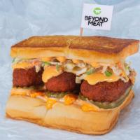 Beyond® The Cheesy Chick · Two crispy fried Beyond® tenders (plant based), spiced to your liking, Plain, Nashville Hot ...