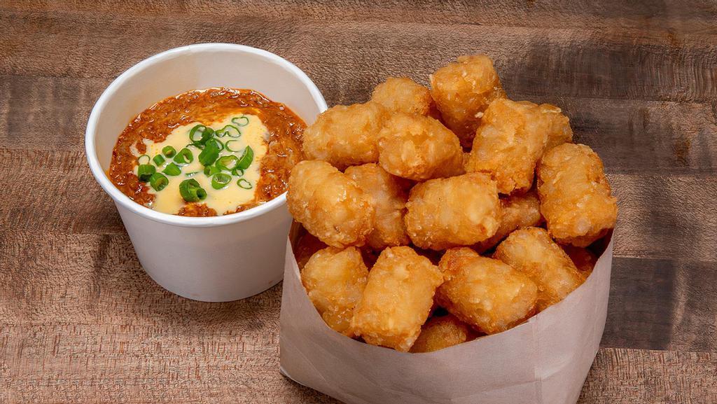 Chili Cheese Tots · All beef no bean chili, Haus cheese sauce, green onions.