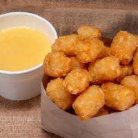 Cheese Tots · Crispy tots with cheese sauce