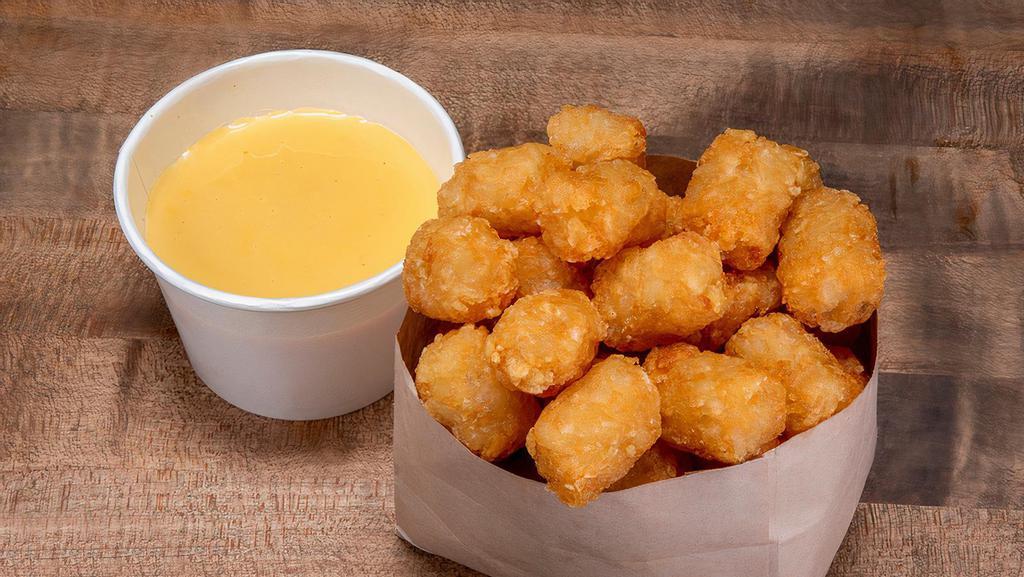 Cheese Tots · crispy tots with Haus cheese sauce.
