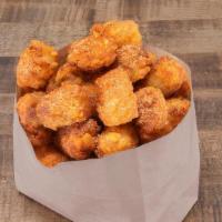 Hot Tots · Tater Tots dusted with Hot Haus Rub. Spicy and addictive.  Served with Miso Ranch or Blue Ch...