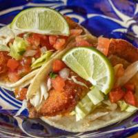 Fish Taco · Corn tortillas served with fried marinated fish, lightly breaded, onions, cilantro, and sals...