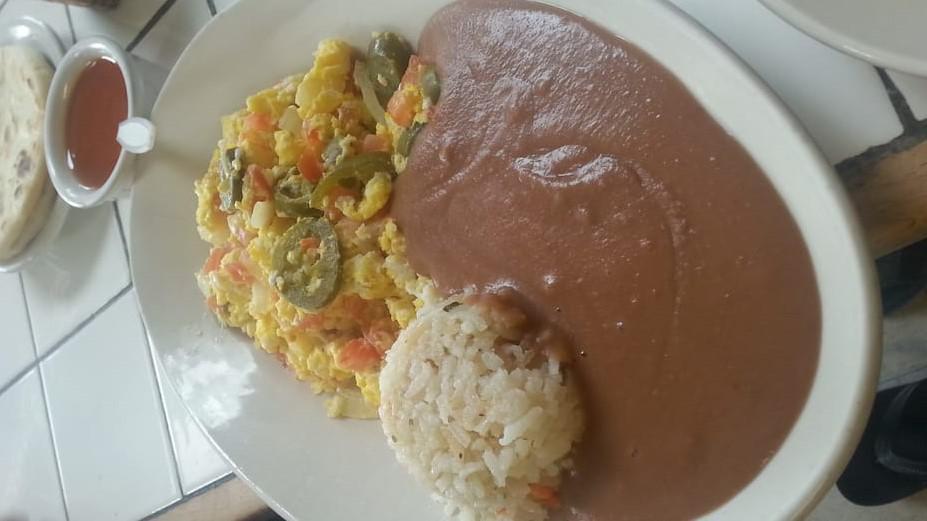 Huevos ala Mexicana · 2 Scrambled eggs with tomato, onion, jalapenos served with rice and refried beans and two hand made corn tortillas