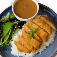 Massaman Crispy Chicken Curry · Sweet Thai curry, fragrant spices with coconut milk + Jasmine rice and Salad