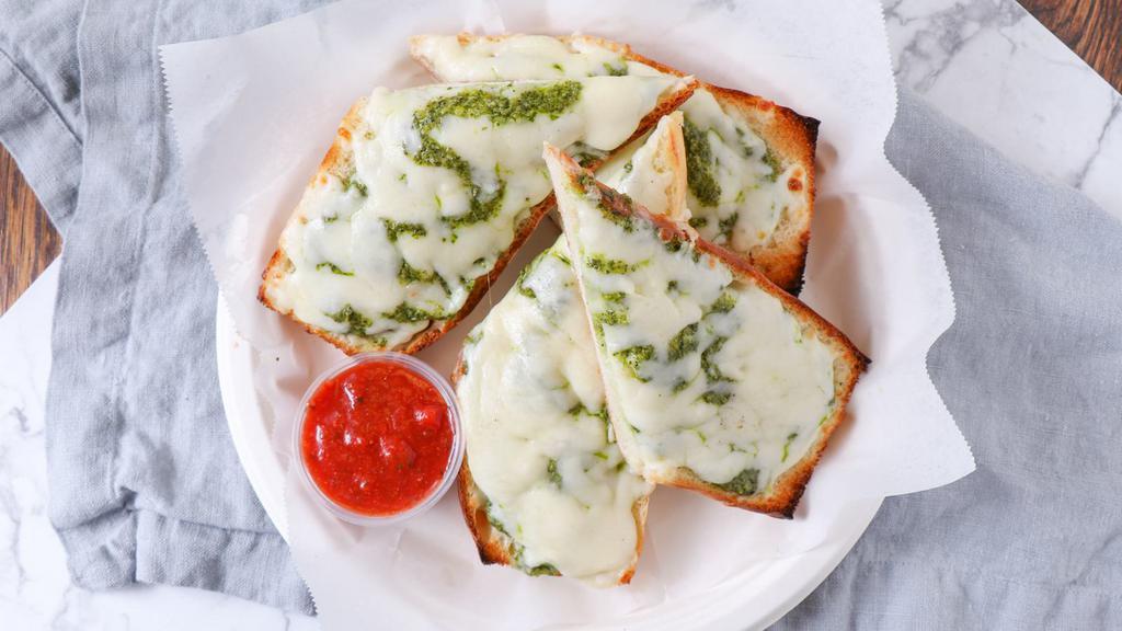 Garlic Bread with Pesto Sauce and Cheese · 