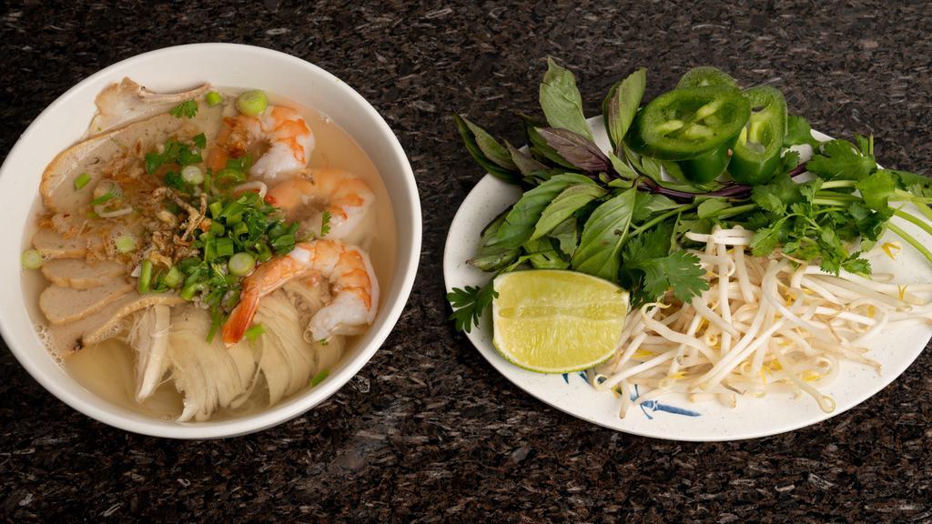 21. Hủ Tiếu Nam Vang · Rice noodle-soup with shrimp, fish cake, slices of pork, ground pork, chicken.