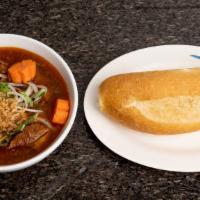 30. Bánh Mì Bò Kho · Beef stew with bread. Contains peanut
