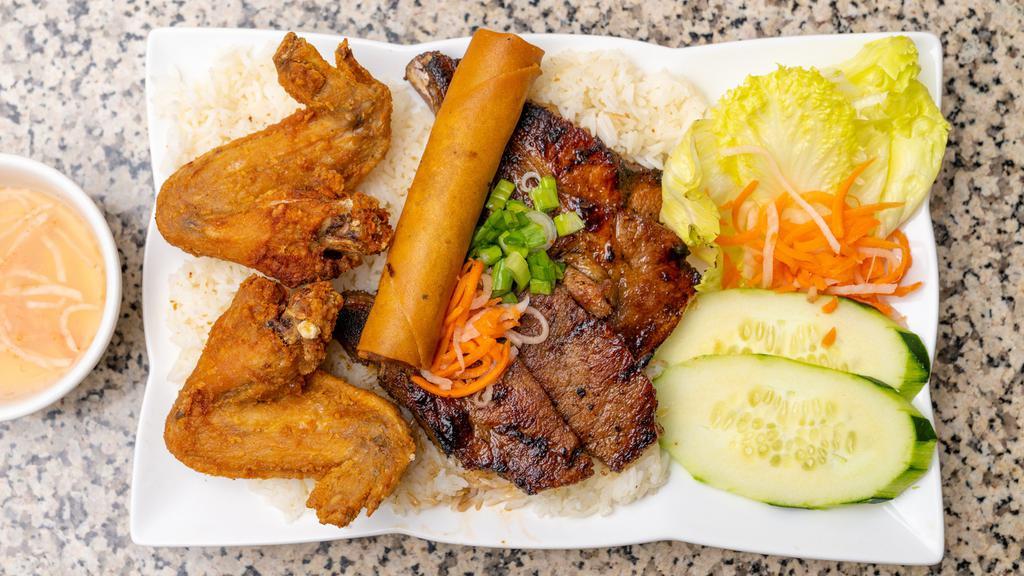 38. Combo Plate · Grilled pork chop, two fried chicken wings and egg roll with steamed rice.