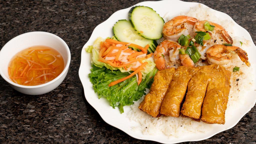 41. Cơm Bỏ or Tôm Tàu Hủ Ky · BBQ beef or BBQ shrimp with shrimp cake and steamed rice.