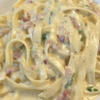 Fettuccine Carbonara · Carbonara is an Italian pasta  dish from Rome made with egg, hard cheese, smoked pancetta an...