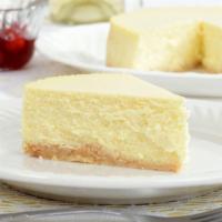 New York Cheese Cake · A creamy and wich New York cheesecake sitting on a graham cracker base.
