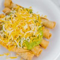 5 rolled  tacos · guacamole and cheese