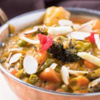 Vegetable Korma · Mixed vegetables with nuts, gently simmered in aromatic creamy sauce.